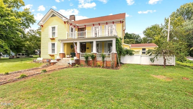 740 W 2nd N St, Morristown, TN 37814 - rear view of property featuring a yard, a porch, a chimney, and a balcony