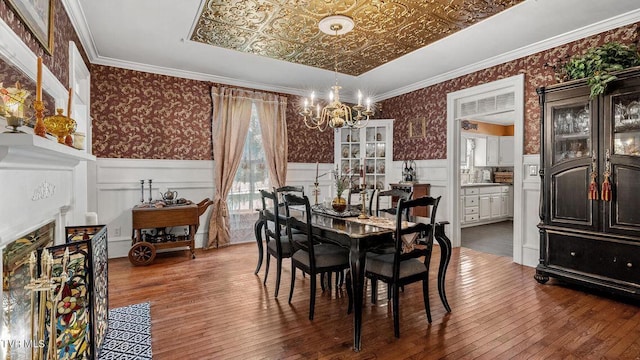 740 W 2nd N St, Morristown, TN 37814 - dining space featuring wallpapered walls, an ornate ceiling, crown molding, and a wainscoted wall