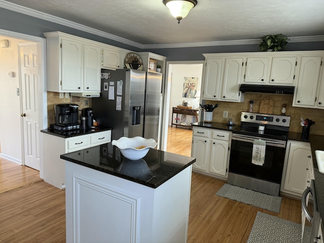 kitchen with white cabinetry, stainless steel appliances, a kitchen island, and light hardwood / wood-style flooring