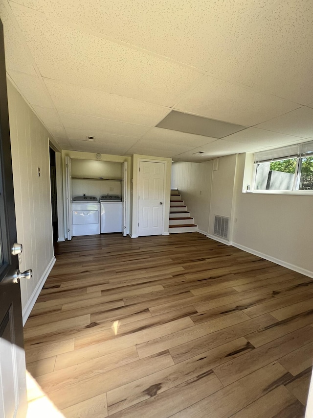 interior space featuring separate washer and dryer and wood-type flooring