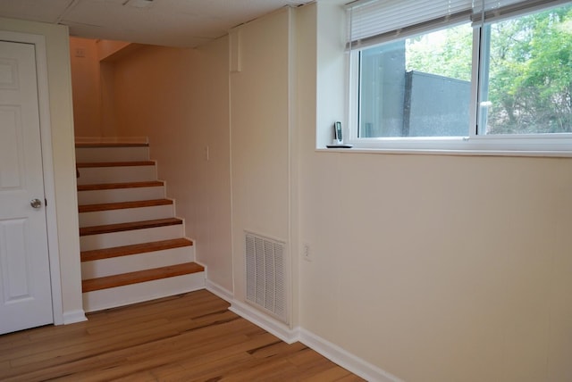 stairs with wood-type flooring