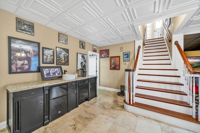 interior space with an ornate ceiling, baseboards, and stairway