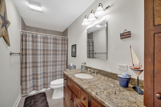 bathroom with a shower with curtain, toilet, vanity, and tile patterned floors