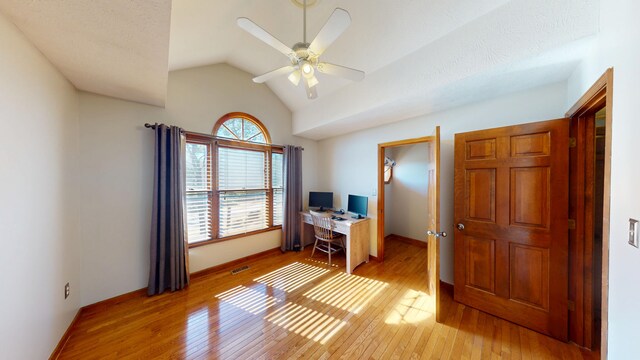 office area with ceiling fan, lofted ceiling, and light hardwood / wood-style flooring