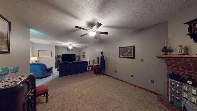 carpeted bedroom with ceiling fan, a textured ceiling, and a brick fireplace