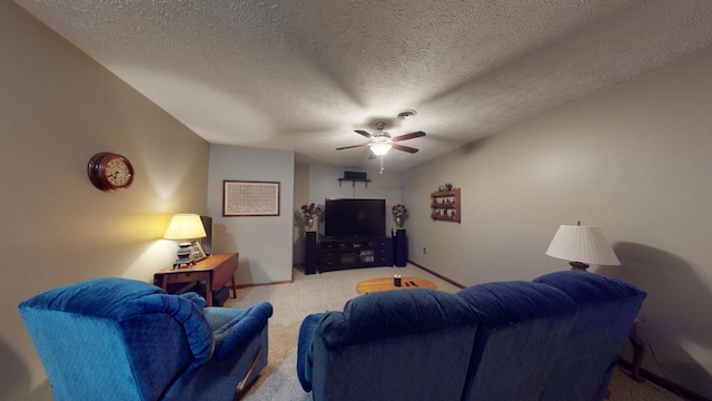 living room with carpet, ceiling fan, and a textured ceiling