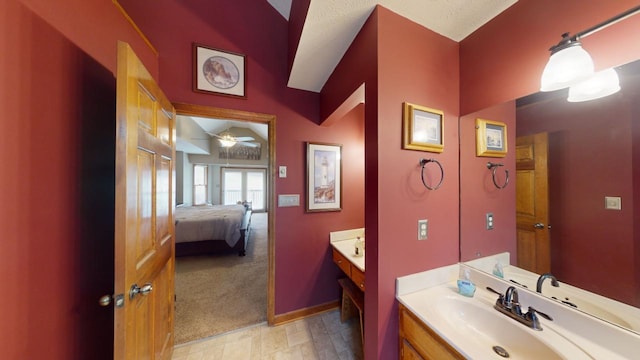 bathroom featuring ceiling fan and vanity