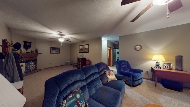 living room featuring light carpet, ceiling fan, and a textured ceiling