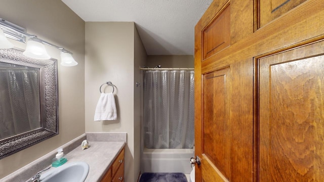 bathroom featuring vanity and a textured ceiling