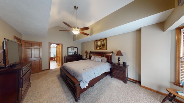 bedroom featuring light carpet, vaulted ceiling, and ceiling fan