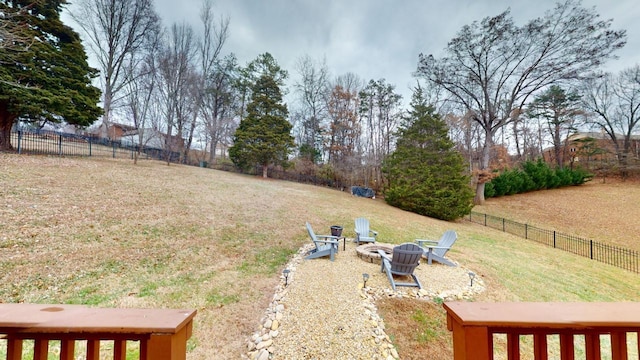 view of yard featuring an outdoor fire pit