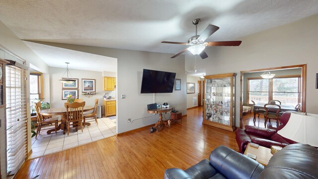 dining area with light tile patterned floors and a textured ceiling