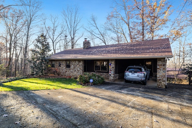 ranch-style home with a garage and a front lawn