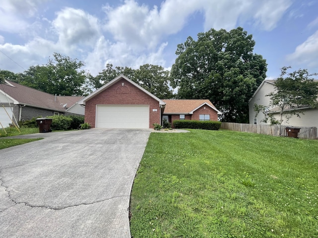 ranch-style house featuring an attached garage, driveway, and brick siding