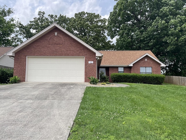 ranch-style home featuring brick siding, concrete driveway, an attached garage, and roof with shingles