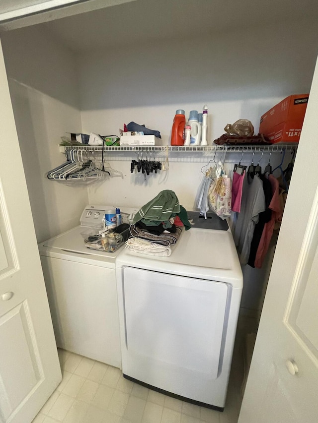 washroom with separate washer and dryer