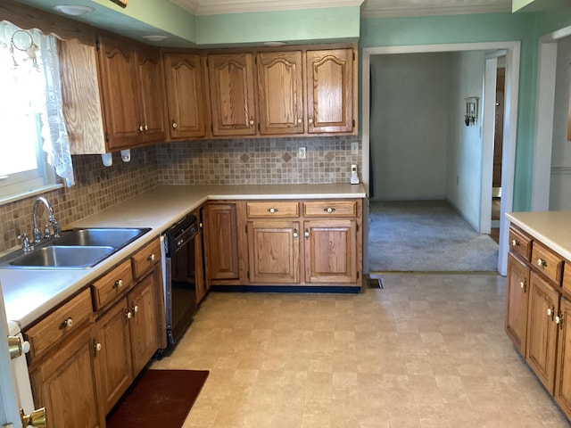 kitchen with sink, dishwasher, crown molding, and tasteful backsplash