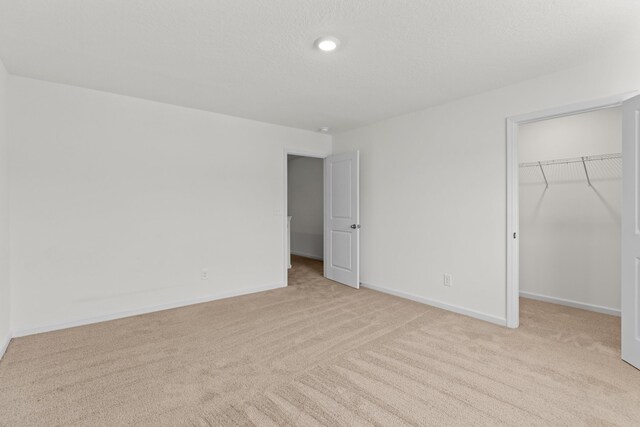 305 Eclipse Ln, Knoxville, TN 37924 - unfurnished bedroom featuring light colored carpet, a spacious closet, and a closet