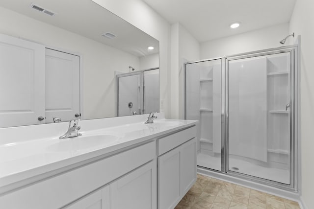 305 Eclipse Ln, Knoxville, TN 37924 - bathroom featuring a stall shower, double vanity, and recessed lighting