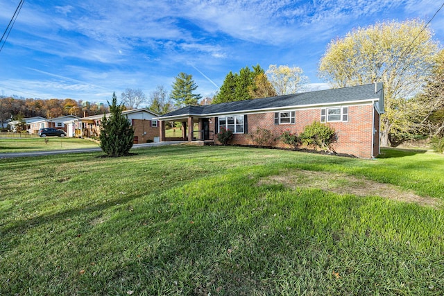 single story home with a front yard