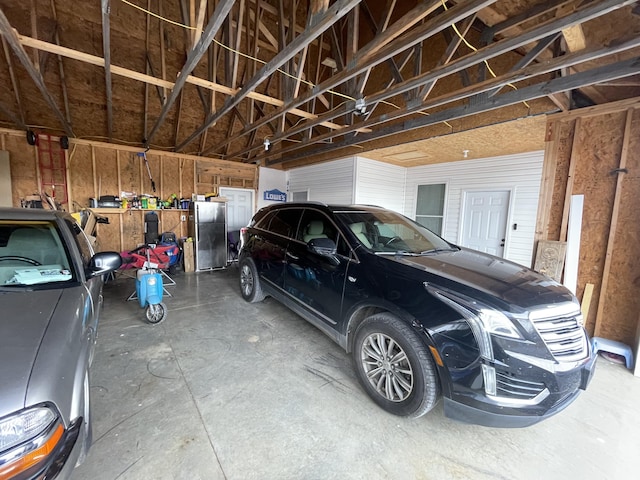 garage with freestanding refrigerator