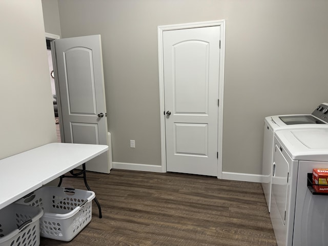 laundry room featuring washing machine and dryer and dark hardwood / wood-style floors