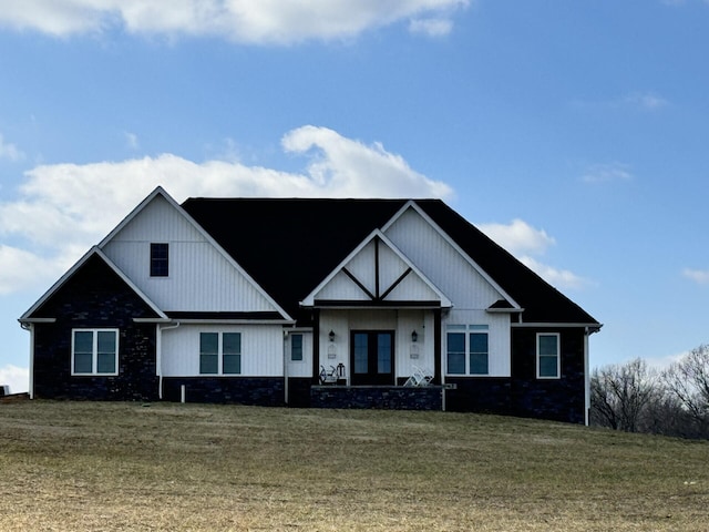 view of front of house featuring french doors and a front yard