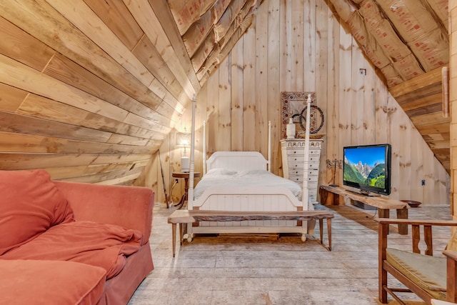 bedroom with wood walls, wood-type flooring, and vaulted ceiling