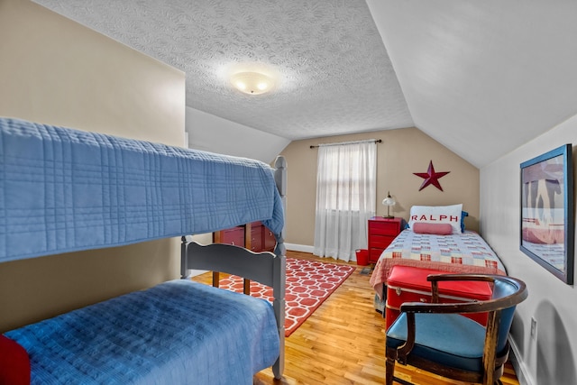 3004 Vine St, White Pine, TN 37890 - bedroom with wood finished floors, lofted ceiling, and a textured ceiling