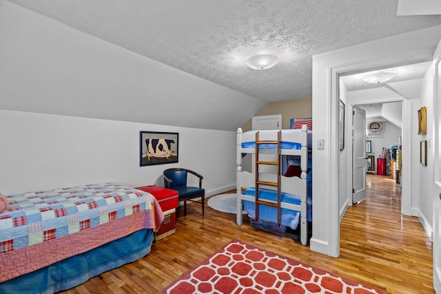 3004 Vine St, White Pine, TN 37890 - bedroom with wood finished floors, a textured ceiling, and vaulted ceiling
