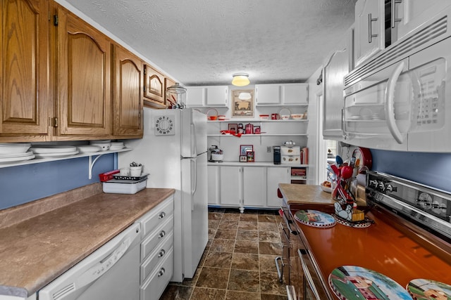 3004 Vine St, White Pine, TN 37890 - kitchen with white appliances, stone finish flooring, a textured ceiling, brown cabinets, and open shelves