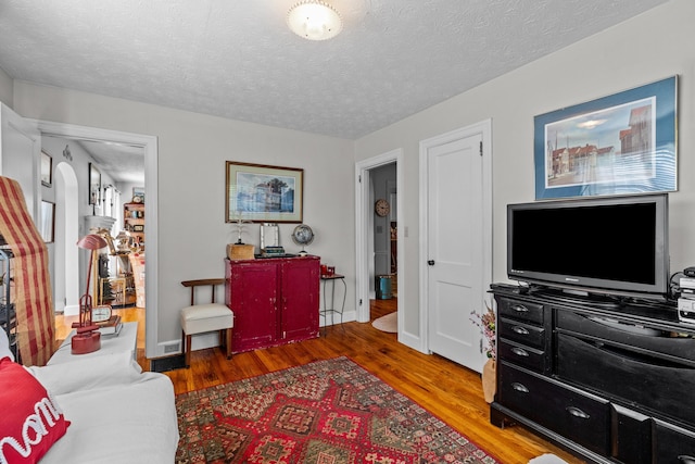 3004 Vine St, White Pine, TN 37890 - living room featuring wood finished floors and a textured ceiling