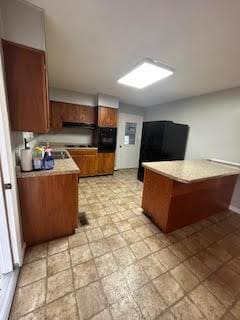 kitchen with brown cabinets and light countertops