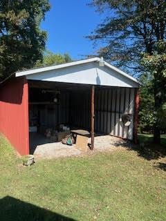 view of outdoor structure with a detached carport