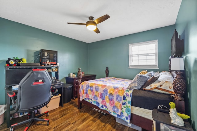bedroom featuring a ceiling fan and wood finished floors