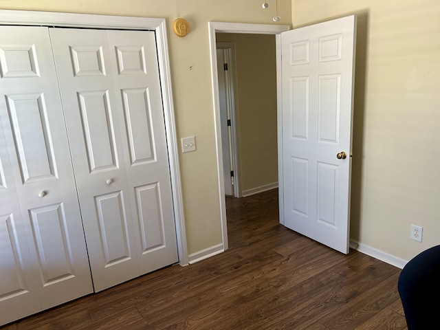 1623 Monte Vista Dr, Sevierville, TN 37862 - unfurnished bedroom featuring baseboards, dark wood-style flooring, and a closet