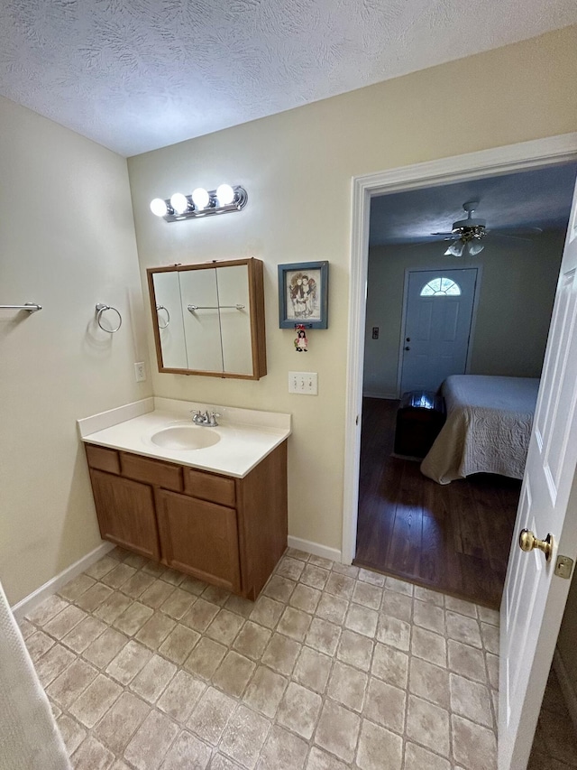 1623 Monte Vista Dr, Sevierville, TN 37862 - bathroom with vanity, baseboards, and a textured ceiling