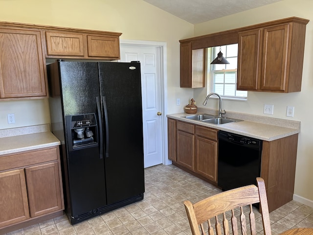 1623 Monte Vista Dr, Sevierville, TN 37862 - kitchen featuring black appliances, a sink, vaulted ceiling, light countertops, and brown cabinets