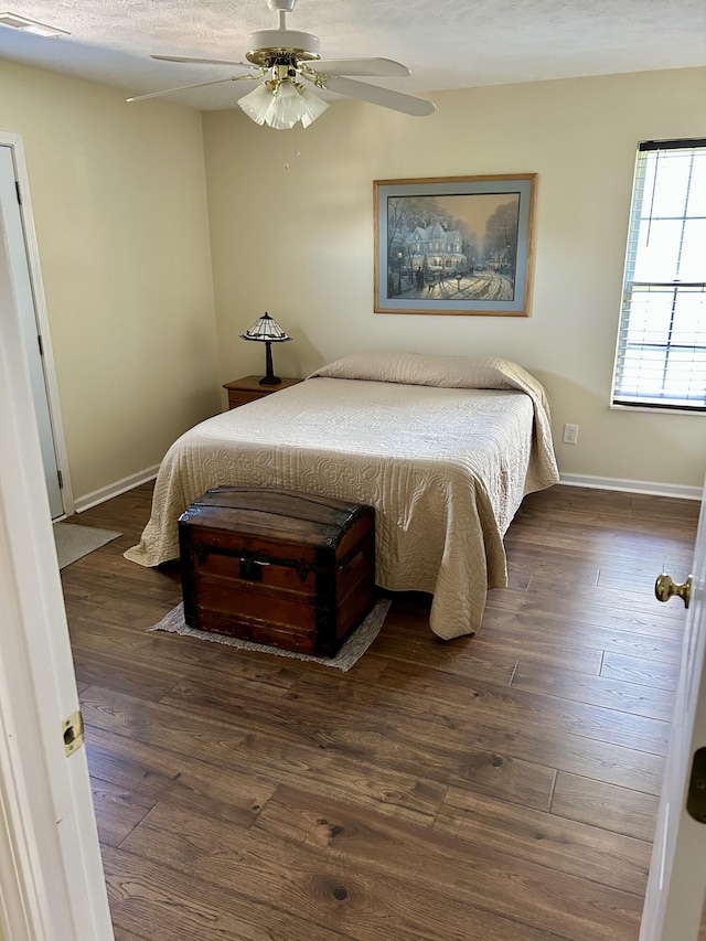 1623 Monte Vista Dr, Sevierville, TN 37862 - bedroom featuring dark wood-style flooring, baseboards, and ceiling fan