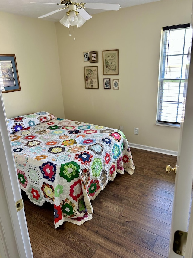 1623 Monte Vista Dr, Sevierville, TN 37862 - bedroom featuring wood finished floors, ceiling fan, and baseboards