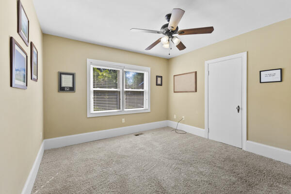 1211 W 6th N St, Morristown, TN 37814 - carpeted empty room featuring a ceiling fan and baseboards