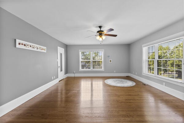 1211 W 6th N St, Morristown, TN 37814 - unfurnished room with plenty of natural light, a ceiling fan, and wood finished floors
