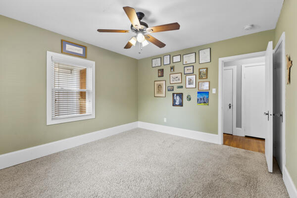 1211 W 6th N St, Morristown, TN 37814 - empty room with carpet flooring and a ceiling fan