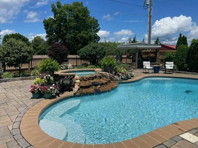2657 Lakemoore Dr, Morristown, TN 37814 - view of pool featuring an in-ground hot tub, a patio area, and a fenced backyard