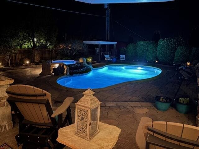 2657 Lakemoore Dr, Morristown, TN 37814 - pool at twilight featuring a patio area, fence, and a pool with connected hot tub