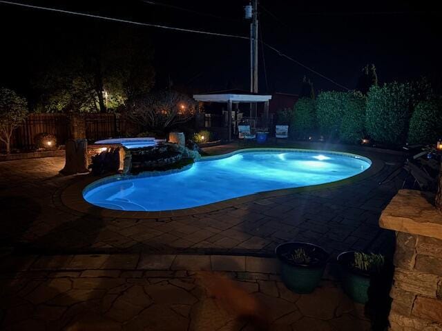 2657 Lakemoore Dr, Morristown, TN 37814 - pool at twilight featuring a patio, a fenced backyard, and a pool with connected hot tub