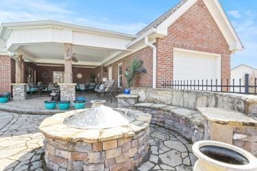 view of patio featuring outdoor lounge area and fence