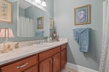 bathroom featuring baseboards and vanity