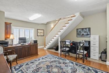 home office with wood finished floors and baseboards