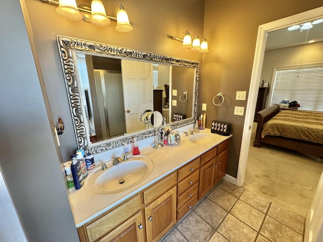 bathroom featuring tile patterned flooring, walk in shower, and vanity